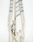 Grey stripes on a cream colour plain colour with linen & cotton blends with knotted fringe hanging.