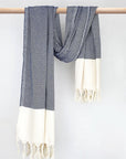 Diamond pattern cotton scarf in navy colour with knotted fringe and hand-twisted style on the stick.