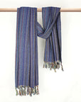 Multi-colour scarf cotton in navy base colour with knotted fringe and hand-twisted style on the stick.