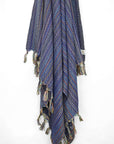 Multi-colour scarf cotton in navy base colour with knotted fringe hanging.
