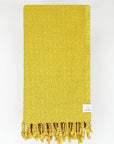 Folded cotton scarf is handwoven in plain mustard colour.