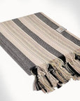 Side image of folded vertical stripes hammam towel with thin and thick colourful.