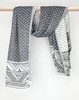 Double-sided a black colour towel with jacquard patterns with hand-twisted style on the stick.