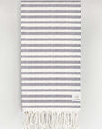 Folded cotton towel in plain navy colour.
