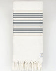 Folded cotton & linen towel with black stripes colour.