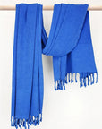 Beach towel in plain blue colour with hand-twisted style on the stick.