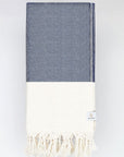 Folded diamond pattern towel in navy colour.