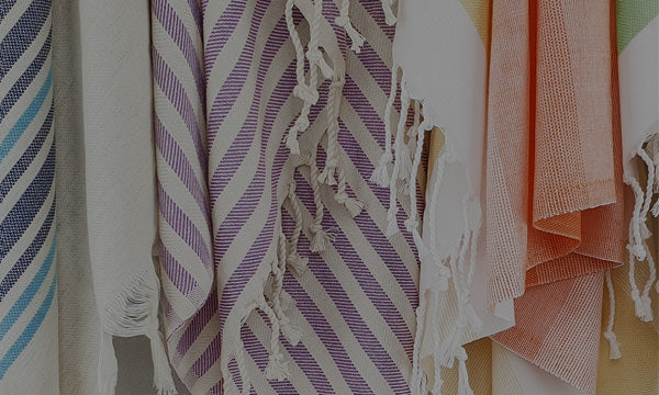 A few colour and tasseled hammam towels close-up view.