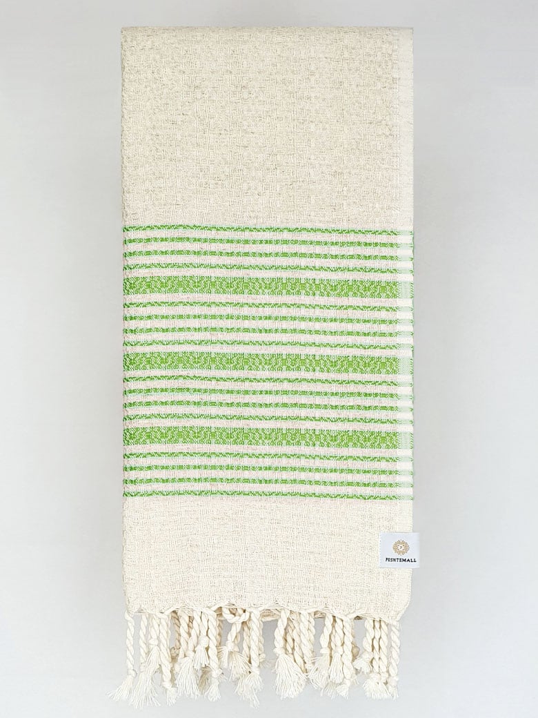 Folded green colour with multiple stripes on a plain beige colour.