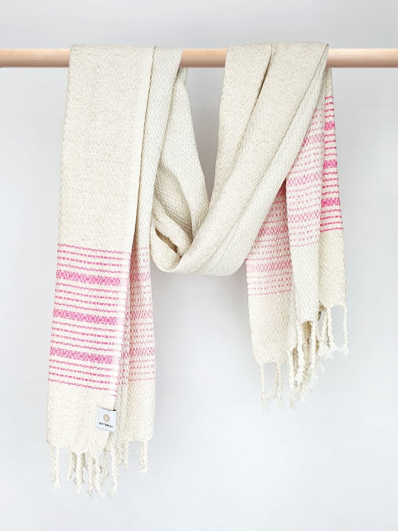 Pink colour with multiple stripes on a plain beige colour and knotted fringe and hand-twisted style on the stick.