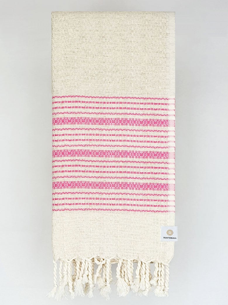 Folded pink colour with multiple stripes on a plain beige colour.