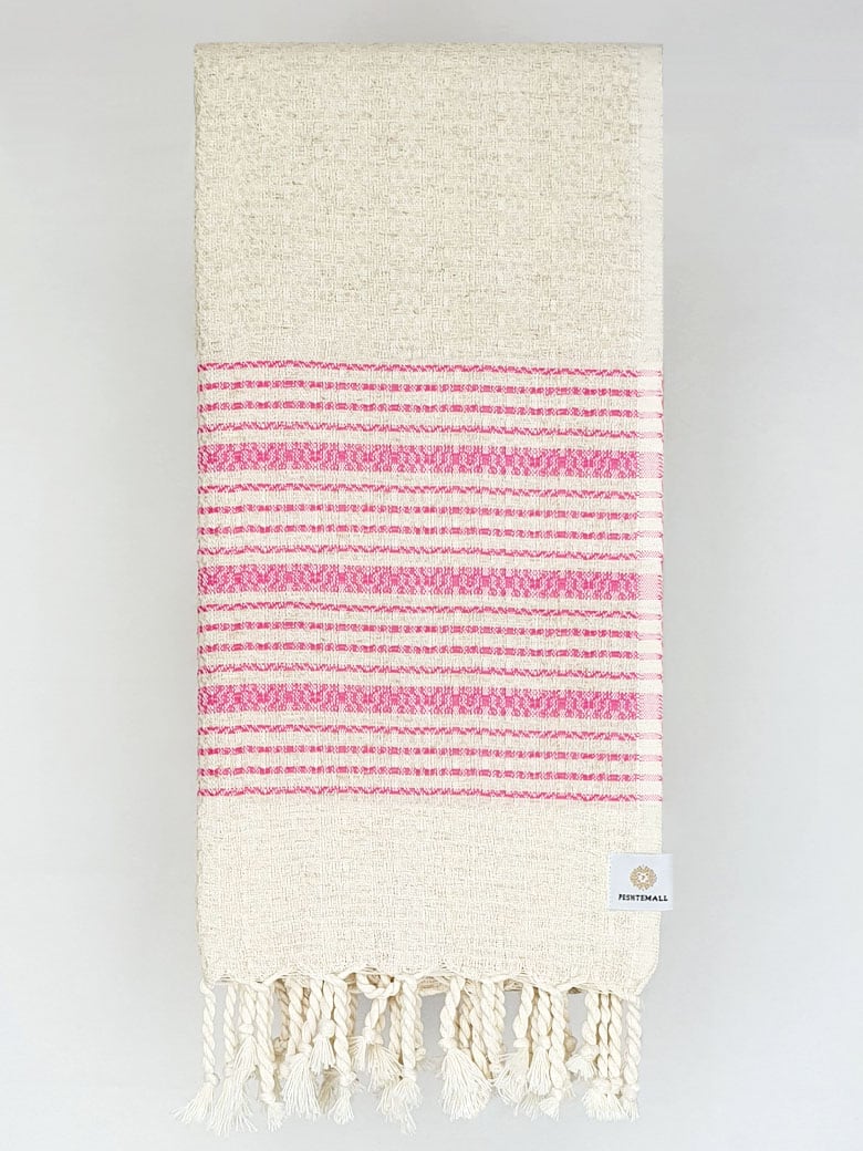 Folded pink colour with multiple stripes on a plain beige colour.