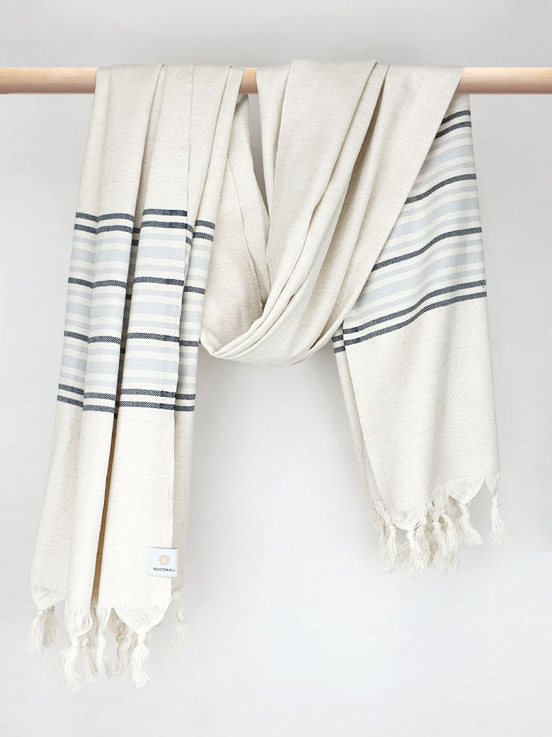Grey stripes on a cream colour plain colour with linen & cotton blends with knotted fringe and hand-twisted style on the stick.