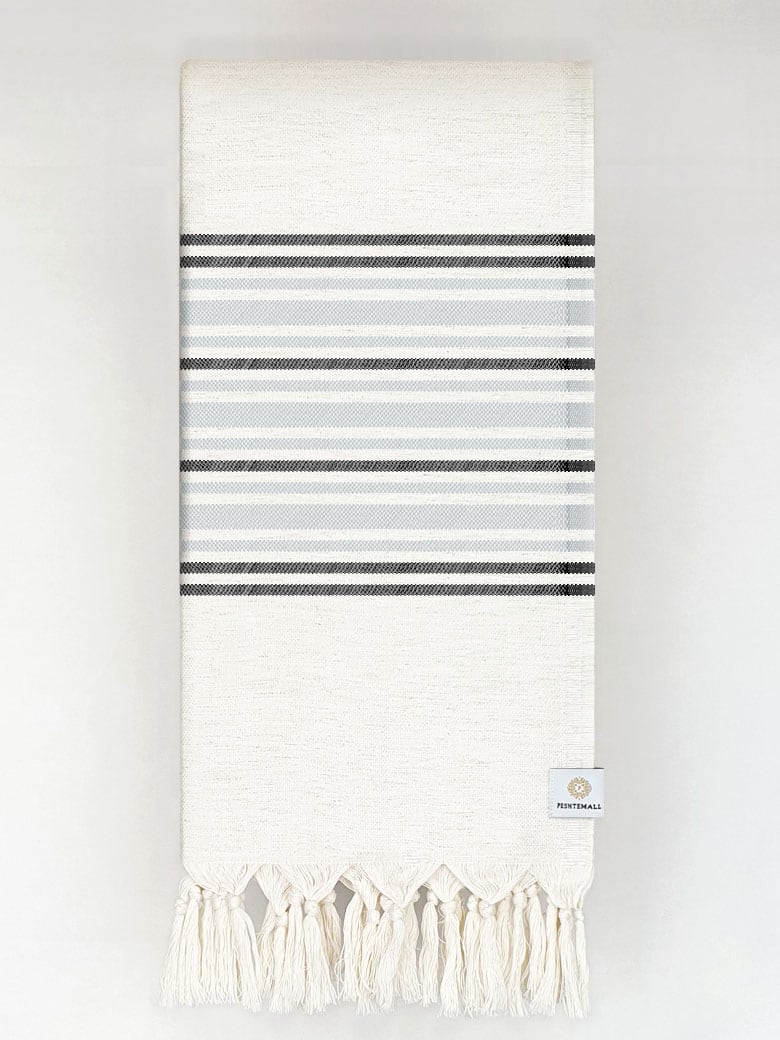 Folded grey stripes on a cream colour plain colour.