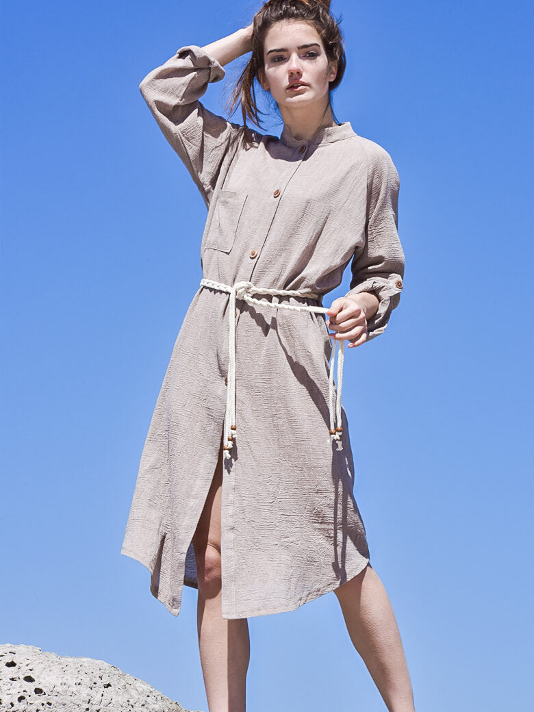 Front image of woman wearing beige boho midi shirt dress with beige rope belt and long sleeves.