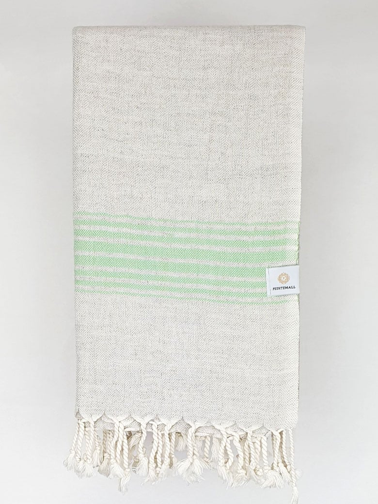 Folded beige linen scarf with a cotton blend and green colour stripes.