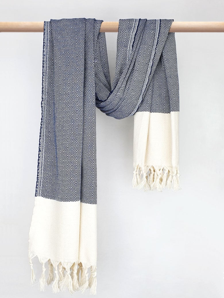 Diamond pattern cotton scarf in navy colour with knotted fringe and hand-twisted style on the stick.