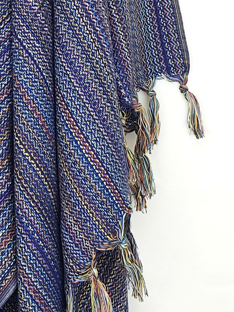 Close-up image of multi-colour scarf cotton in navy base colour with knotted fringe.