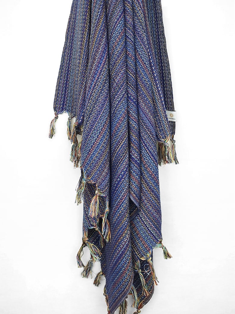 Multi-colour scarf cotton in navy base colour with knotted fringe hanging.