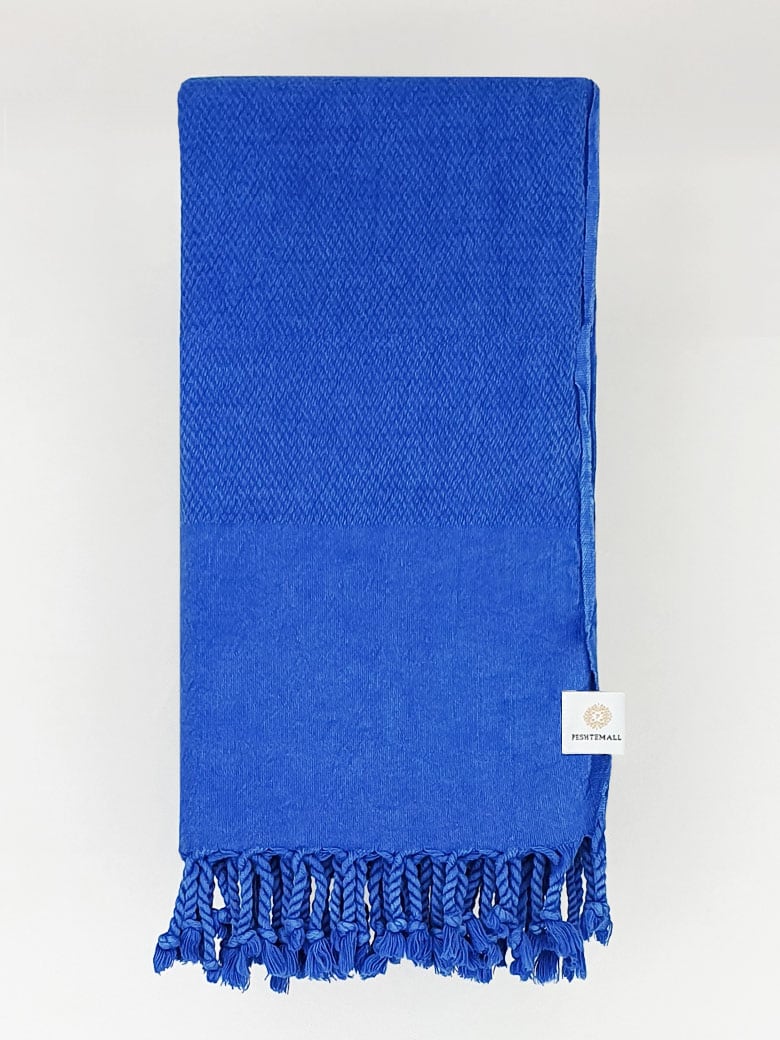 Folded 100% cotton scarf in plain blue colour.