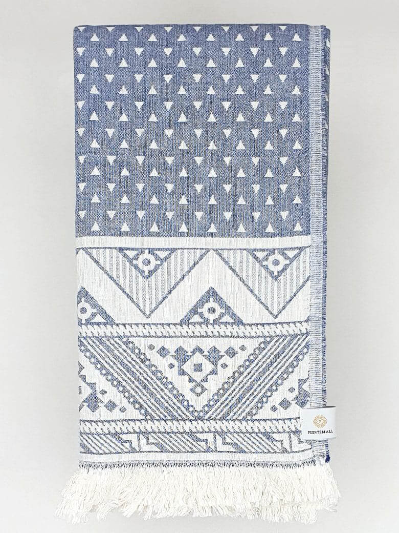 Folded double-sided a denim colour towel with jacquard patterns.