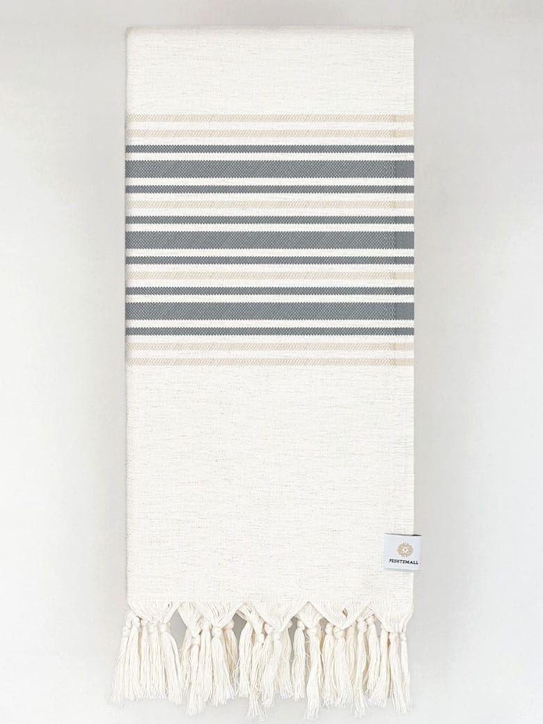 Folded cotton & linen towel with black stripes colour.