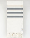 Folded cotton & linen towel with black stripes colour.