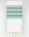 Folded cotton & linen towel with green stripes colour.