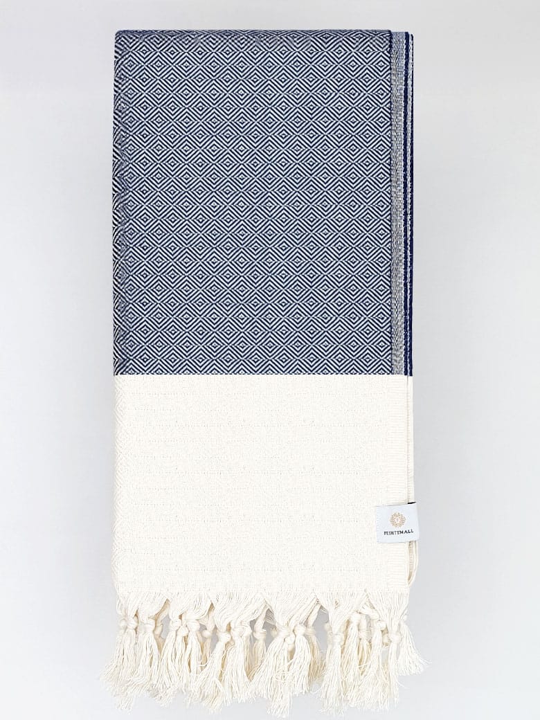 Folded diamond pattern towel in navy colour.