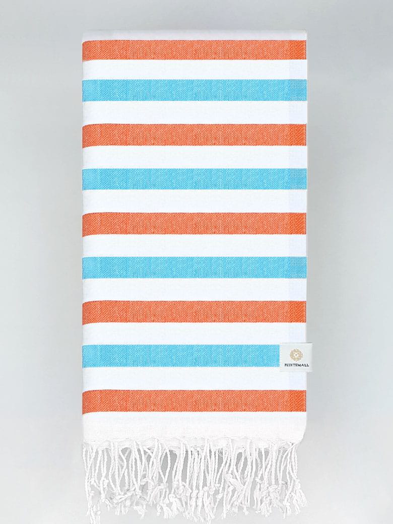 Folded towel with orange & blue horizontal stripes and hand-twisted & knotted fringe.