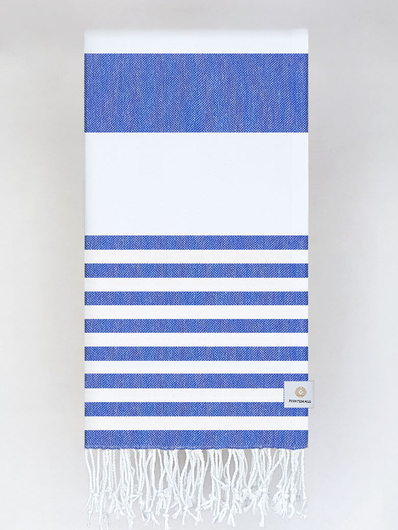 Folded beach towel with blue and white colours stripes and hand-twisted &amp; knotted fringe.
