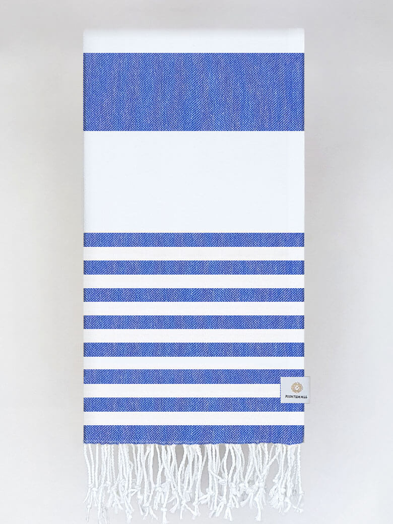 Folded beach towel with blue and white colours stripes and hand-twisted & knotted fringe.