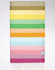 Folded towel with thick colourful stripes and hand-twisted & knotted fringe.