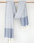 Denim colour towel with white stripes and knotted fringe with hand-twisted style on the stick.